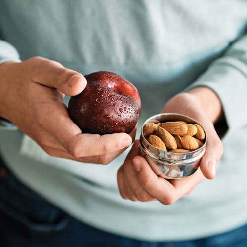 woman holding healthy snacks