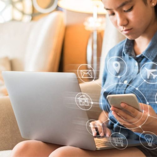 Girl on her cellphone and laptop