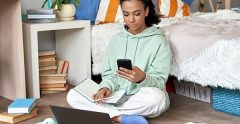 Teen girl doing homework on her laptop